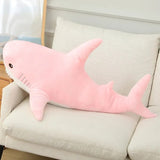 Pink shark-shaped pillow.