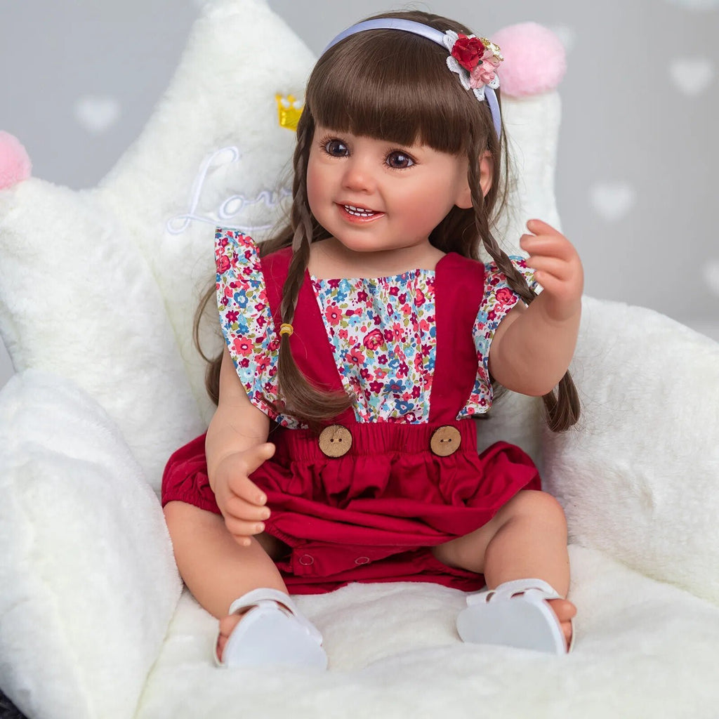 Soft silicone 3D Reborn Doll Cammi Smile in a red dress with white shoes, a collector style doll for display and presents.