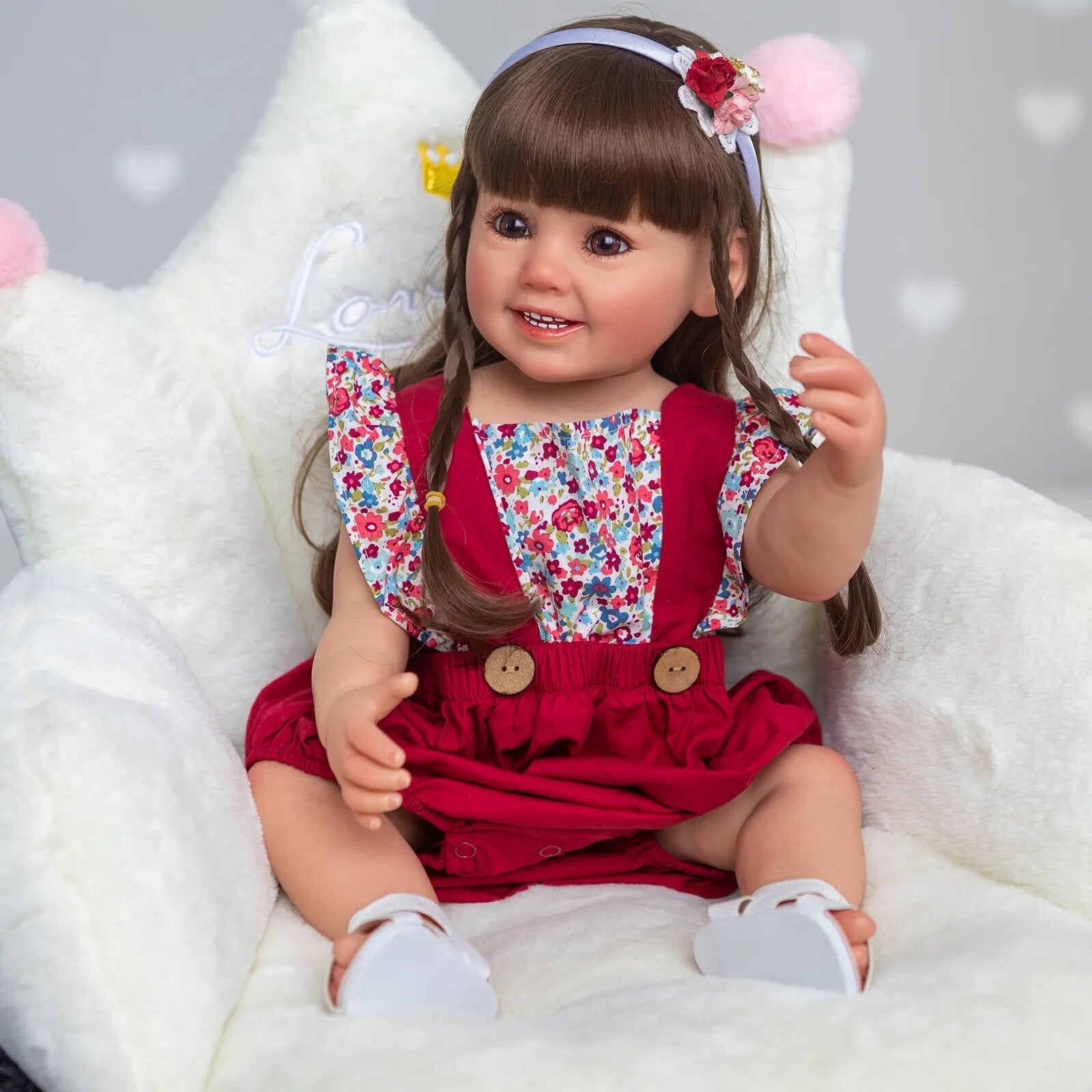 Soft silicone 3D Reborn Doll Cammi Smile in a red dress with white shoes, a collector style doll for display and presents.