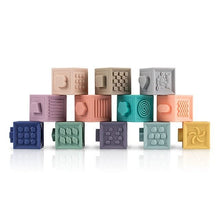 Soft silicone baby building blocks that squeeze easily for teething comfort and grasping practice.