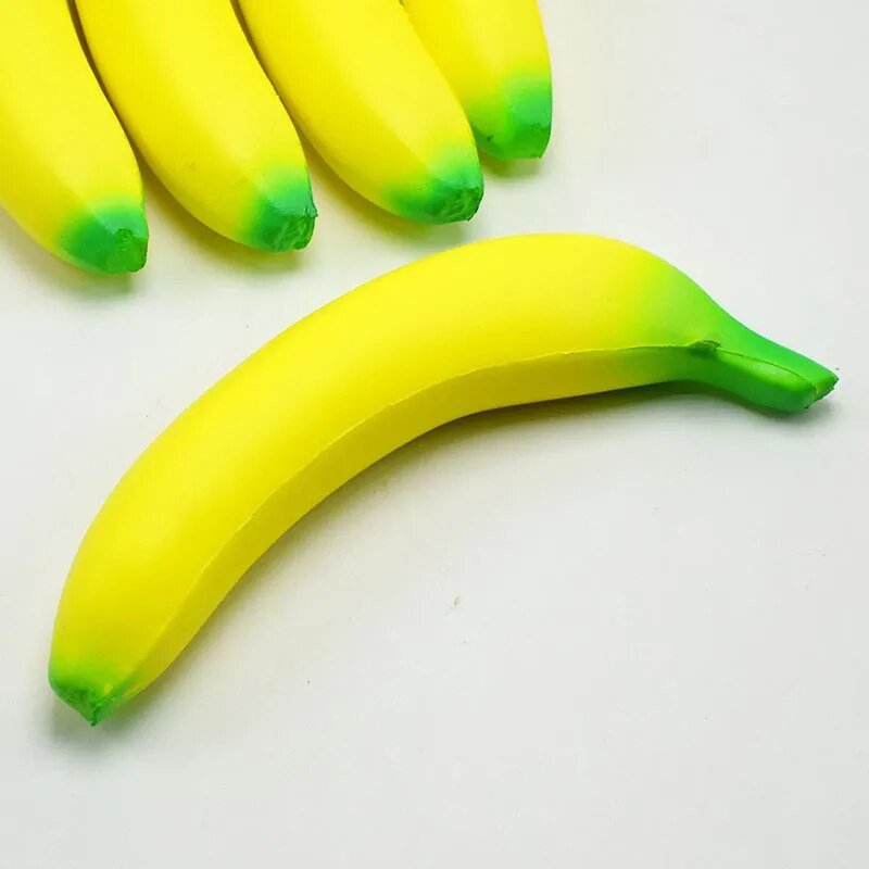 Soft Squishy Banana Toy in yellow and green for stress relief squeezing and fidget play.