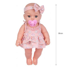 Soft Touch Reborn Baby Doll in pink outfit with pacifier and headband, 30cm size for nurturing play sessions.