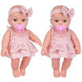 Soft Touch Reborn Baby Doll in matching pink dress and headband, styled as a twin set for nursery play and gifting.