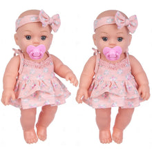 Soft Touch Reborn Baby Doll in matching pink dress and headband, styled as a twin set for nursery play and gifting.