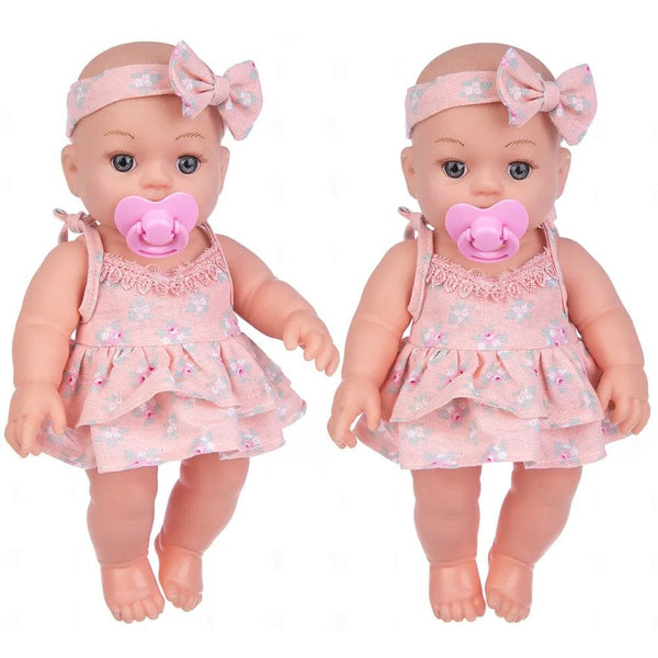 Soft Touch Reborn Baby Doll in matching pink dress and headband, styled as a twin set for nursery play and gifting.