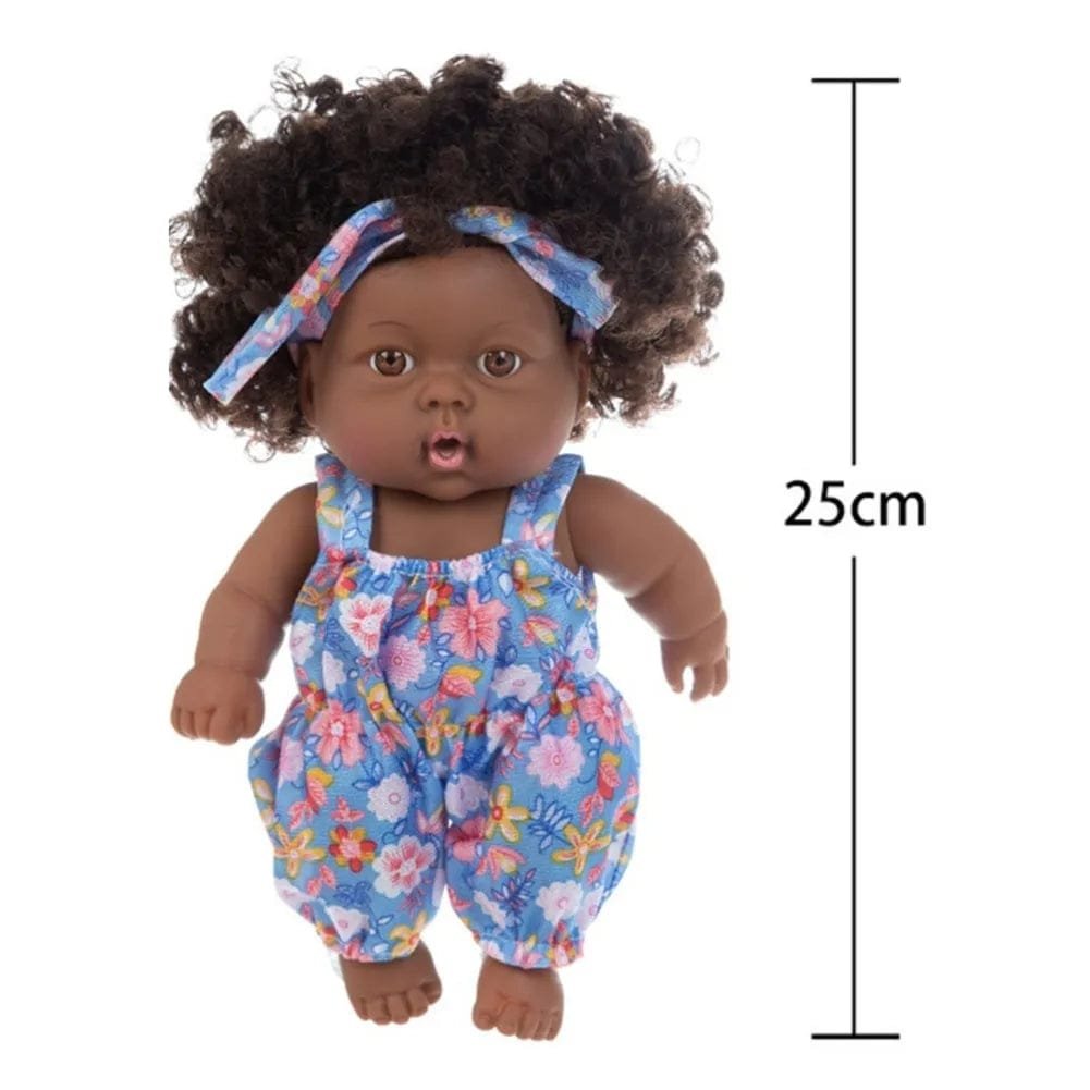 Soft Touch Reborn Baby Doll in floral overalls and headband, 25cm size for nursery styling and gifting.