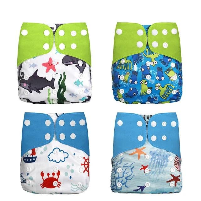 Four colorful children's swim diapers with animal and sea-themed prints.
