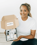 Woman holding a box with skincare products and Sunflower logo