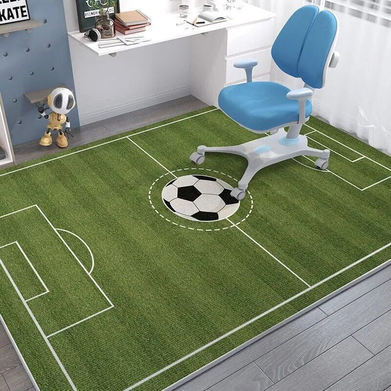 Children's room with a green soccer field rug and blue chair.