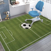 Children's room with a green soccer field rug and blue chair.