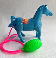 Blue plastic horse toy with a pink tube and a green bulb, second view