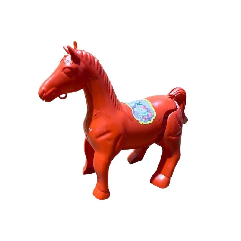 Red-orange plastic horse toy with a saddle sticker on a white background