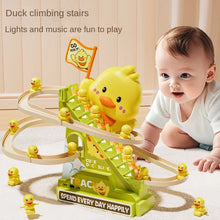 Baby crawling beside a stair climbing duck roller coaster toy with small yellow ducks