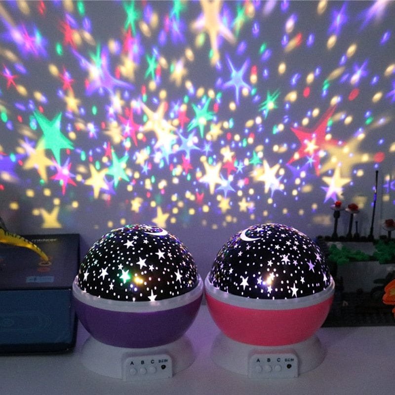 Starry sky LED night light projecting stars onto the wall for relaxing bedtimes, mood lighting, and sleep-time comfort.