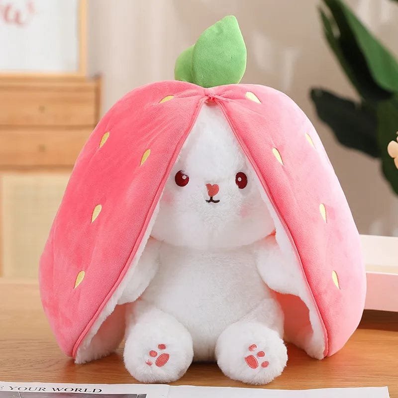 Strawberry plush bag with white bunny peeking out, a soft toy for cuddling, gifting, and nursery display.