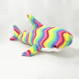 Colorful striped shark plush toy.