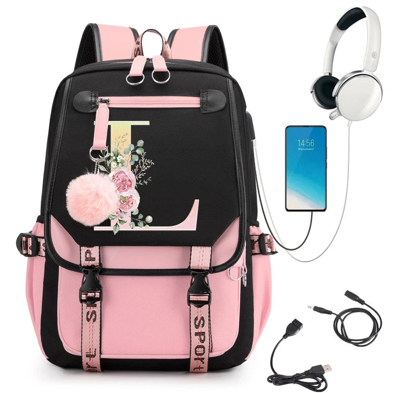 Pink and black backpack with floral design, smartphone, headphones, and USB cable.