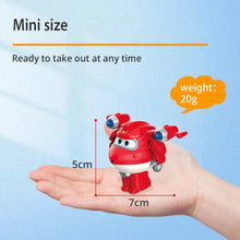 Super Wings Mini Transforming Robots red plane figure held in hand showing 2 inch scale for pocket-sized travel play.