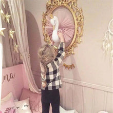 3D Animal Head wall decor swan design used by a child near a nursery mirror for imaginative play and room styling.