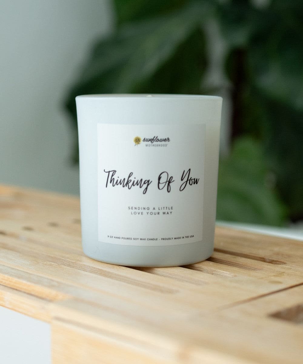 Thinking Of You Candle jar on a wooden surface for relaxing home fragrance, self-care evenings, and gifting.
