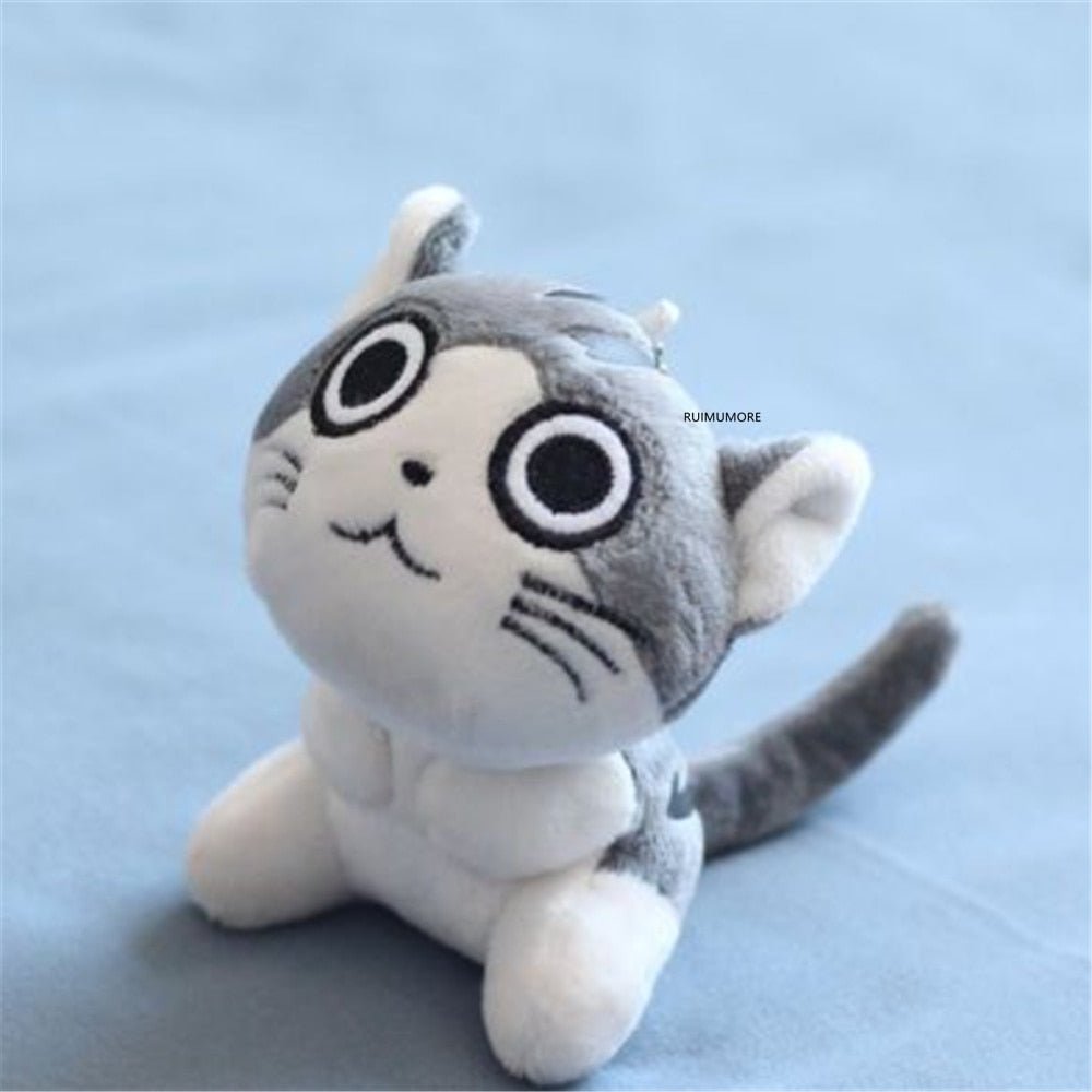 Tiny cat plushie key chain doll with big cartoon eyes, a 9cm stuffed toy for keys, school bags, and cute gifting.