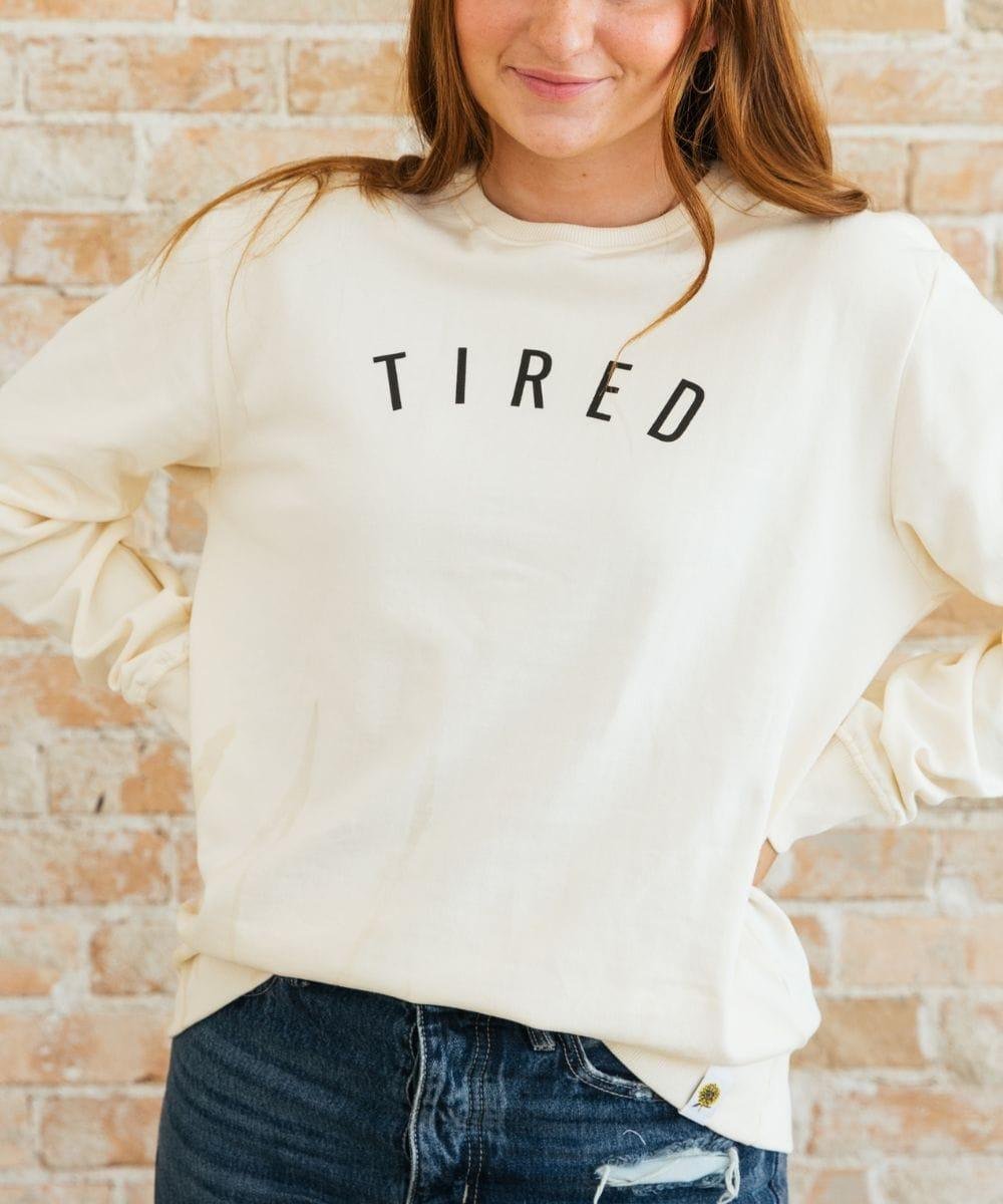 Tired Sweatshirt cream slogan crewneck for relaxed daily wear, coffee runs, and comfortable weekend styling.