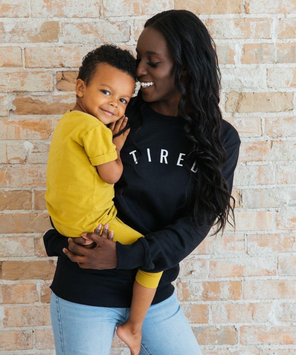 Tired Sweatshirt worn as matching mum and child slogan tops for family photos, gifting, and everyday outings.