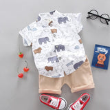 Children's outfit with a white shirt and yellow shorts, red sneakers, and a small bag.