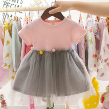 Toddler girls pink top and grey tulle patchwork dress on a hanger for parties, playdates, and casual outings.