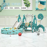 Children's playground equipment with slides and play structures in a room.