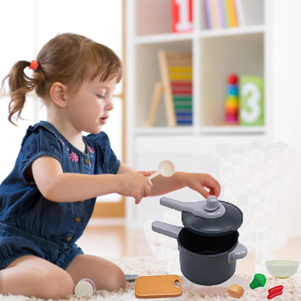 Child playing with toy kitchen set