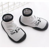 Pair of white pet socks with black accents