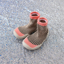 Pair of baby socks with pink accents 