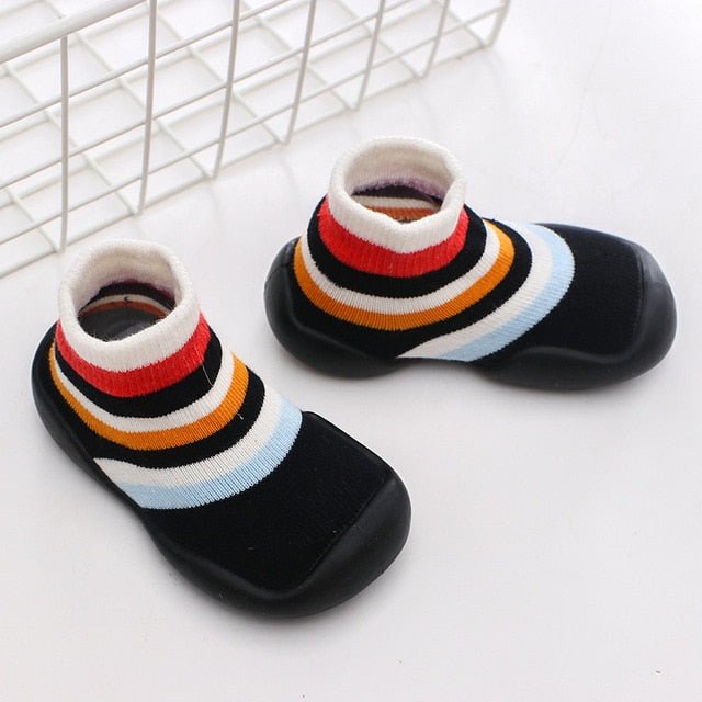 Pair of colorful striped socks on a white background