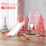 Children's playground equipment including a slide and swing set on a wooden floor.