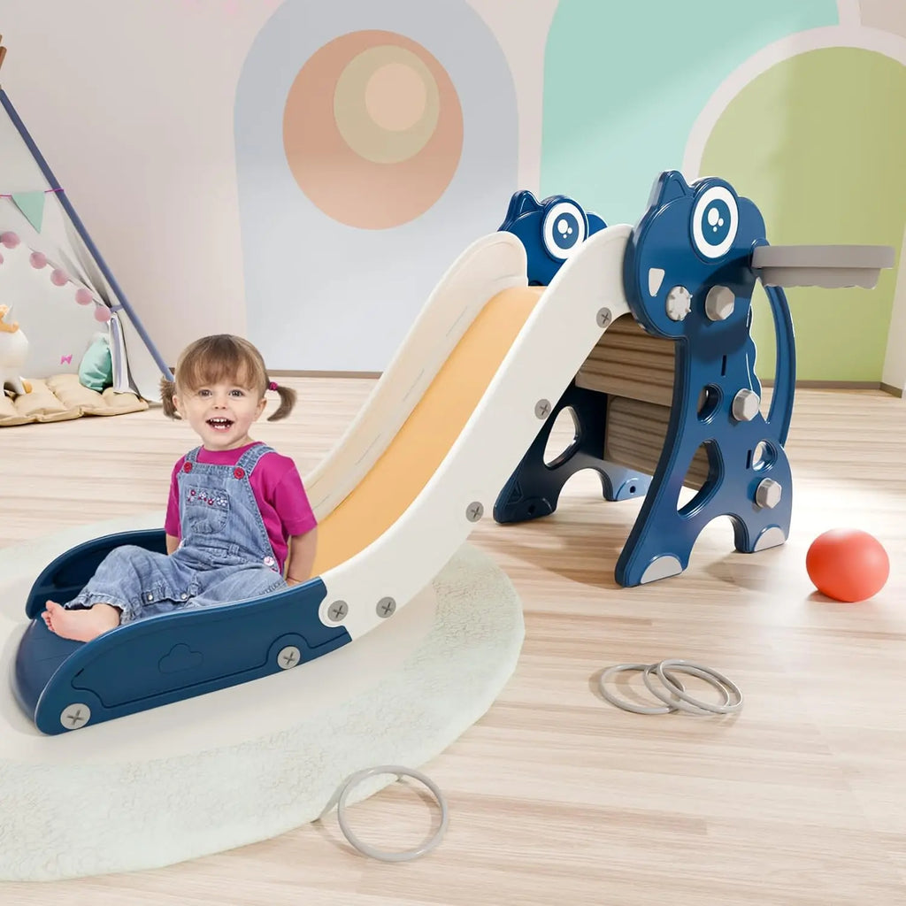 Child playing on a blue and white slide in a colorful indoor play area