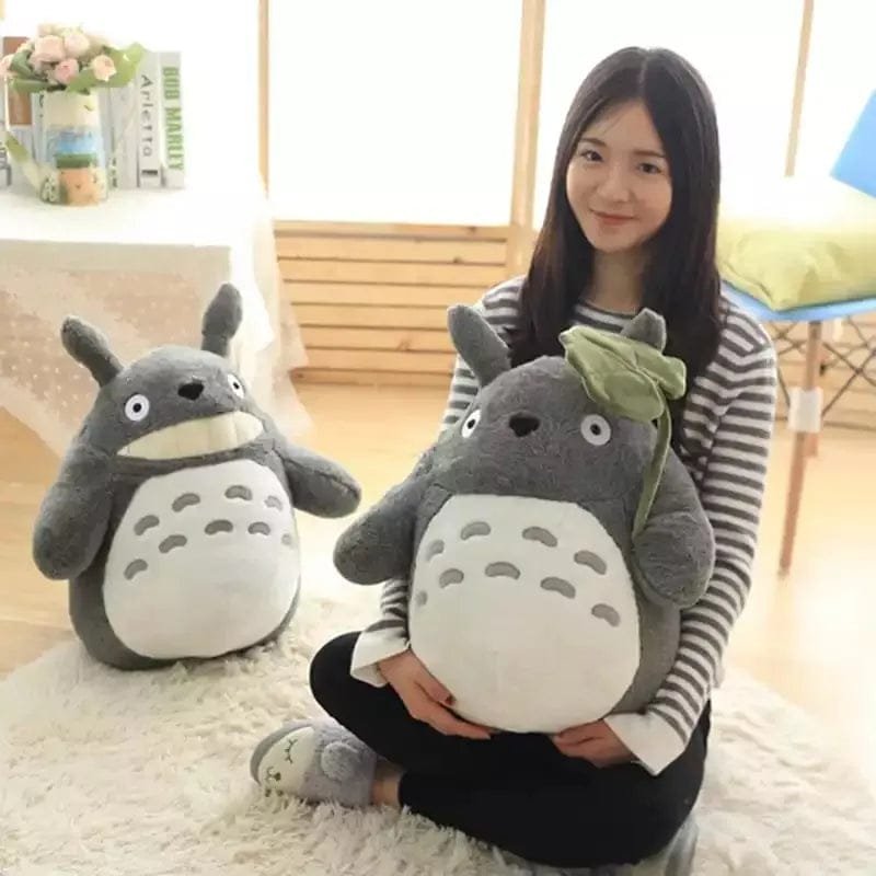 Totoro with Lotus Leaf Plush large anime doll held in hand for cuddling, Christmas gifting, and bedroom decoration.