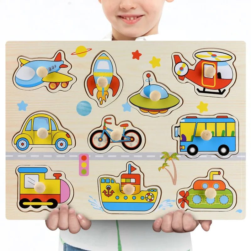 Child holding a Montessori-inspired wooden transportation puzzle toy with various vehicle pieces.