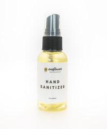 Hand sanitizer bottle with a white label