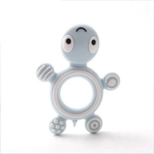 Turtle Silicone Teether in candy blue and white pastel design for baby-safe teething relief.