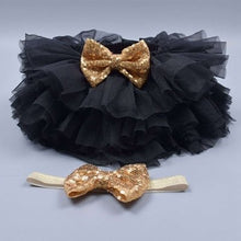 Flat lay of the black tulle tutu bloomers diaper cover and headband set for newborn gifting and outfit planning.