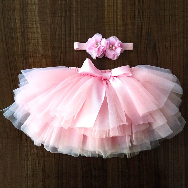Baby Girls Tulle Tutu Bloomers pink ruffled diaper cover with matching headband set for newborn photo shoots and first birthday parties.