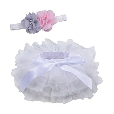 Side view of the frilly white tulle tutu bloomers newborn outfit for summer outings and garden photo sessions.