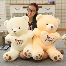 Two large I Love You teddy bears held together, giant plush toys for couples gifting and nursery cuddles.