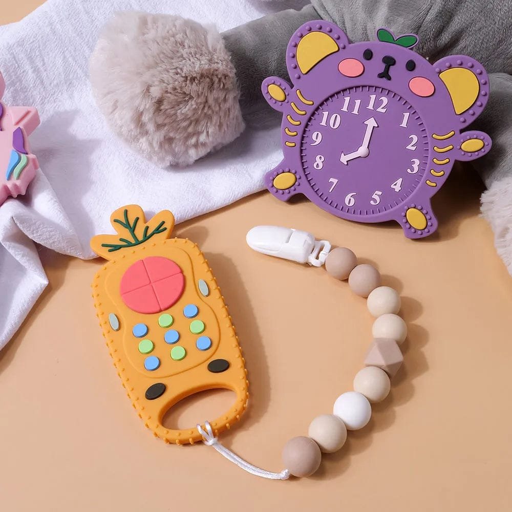 Two remote-shaped silicone baby teether toys for chewing comfort, gum massage, and everyday teething support.