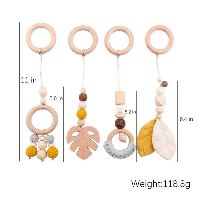 Baby teething toy with wooden rings and colorful beads, shown with measurements and weight.