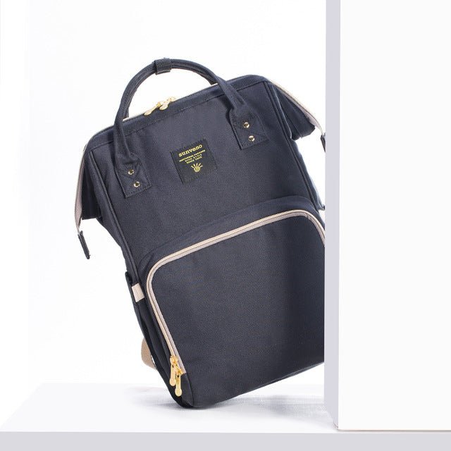 Black backpack with gold zippers