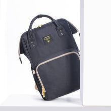 Black backpack with gold zippers
