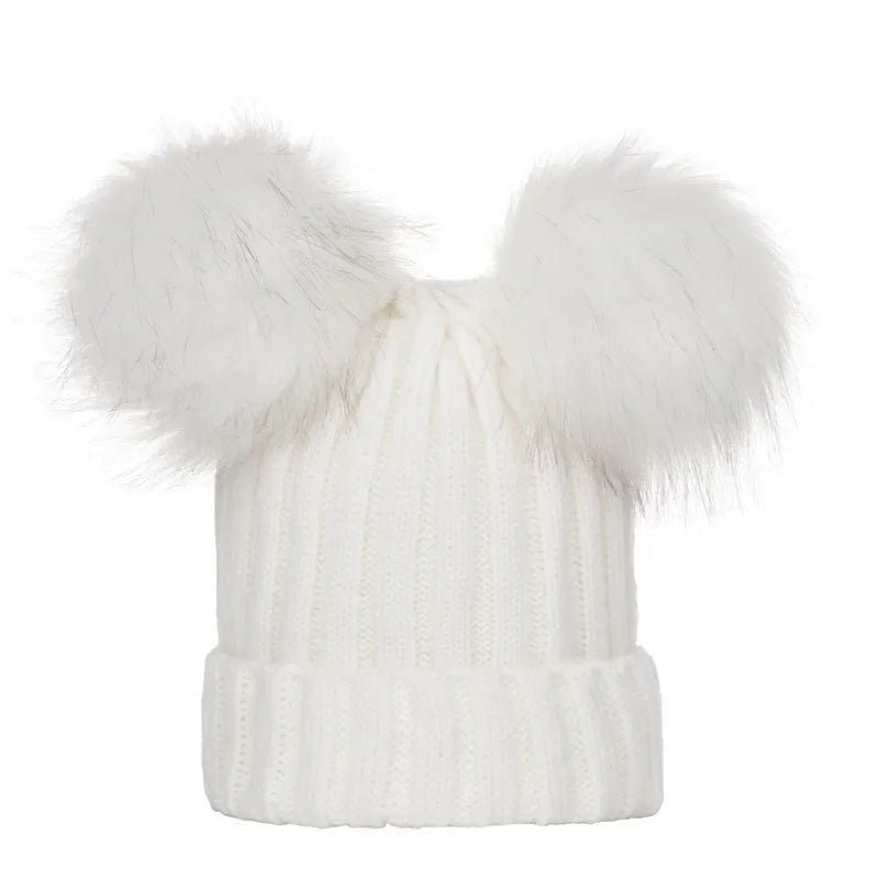 White knit beanie with large fur pom-pom