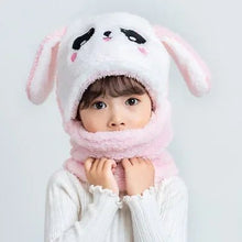 Child wearing a cute bunny hat and scarf